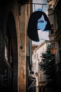 Guild sign of a hairdressing salon in the old town of Pèrigueux, Dordogne, France