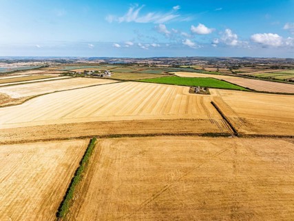 View of Fields and Farms over Cliffs and Trevone Bay from a drone, Trevone, Padstow, Cornwall,