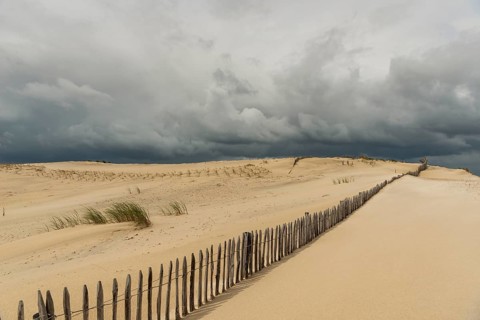 Emerging storm in sunshine in the dunes on the Atlantic coast, Soulac-sur-Mer, France