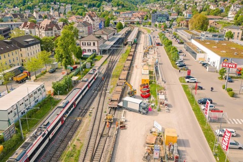 View of railway line and adjacent construction in an urban environment, construction site by