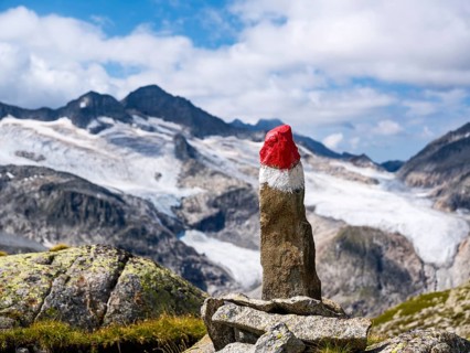 Spitzer Stein as a trail marker, glaciated mountains behind, Venice Group, Hohe Tauern National