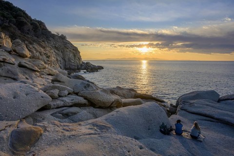 Rock formations in the evening light on, Capo Sant Andrea, Marciana, Livorno Province, Italy