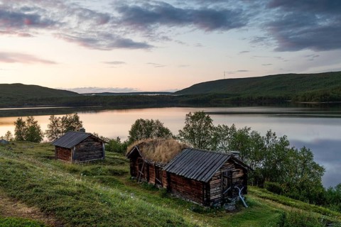 Wooden houses, old church houses, farm buildings on Mantojärvi, Utsjoki or Ohcejohka, Lapland,