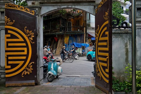A view from a historic temple courtyard of handcrafted bamboo ladders, metre-long bamboo poles,