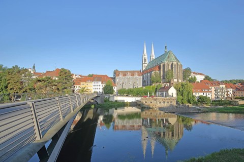 Old town bridge over the Lusatian Neisse and gray Waidhaus, Stadtkirche St. Peter and Paul,