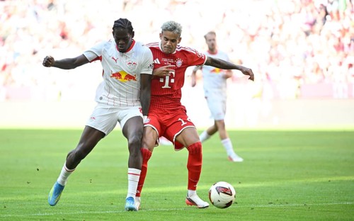 Tackle, Antonio Nusa in action for RasenBallsport RB Leipzig (RBL) (07) against Sacha Boey of FC