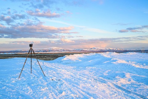 Flatruet, Berg, Härjedalen Län, Sweden, camera on tripod in snowy landscape with mountain panorama