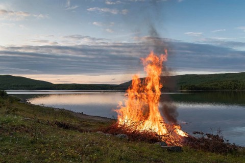 Midsummer night fire, Mantojärvi, Utsjoki or Ohcejohka, Lapland, Finland