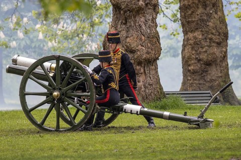 Two gunners of the King's Troop Royal Horse Artillery ready a First World War era field gun before