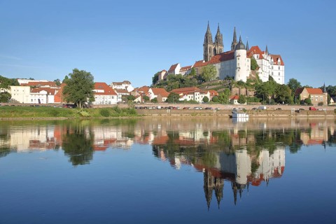 Cityscape with old town bridge, castle hill with Albrechtsburg and cathedral, reflection in the