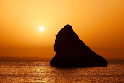 Rocks in the sea at sunrise, Praia Dona Ana, Lagos, Algarve, Portugal
