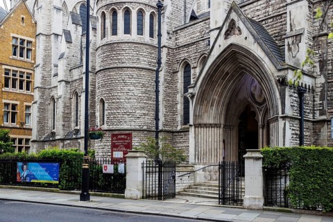 The Gothic entrance and tower of St James's Roman Catholic Church at Spanish Place, Marylebone,
