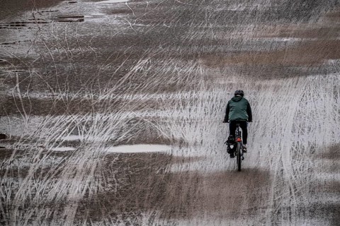 Dirt road, with many tracks of two-wheelers, footprints, cyclists, wet, after rain, parallel, mixed