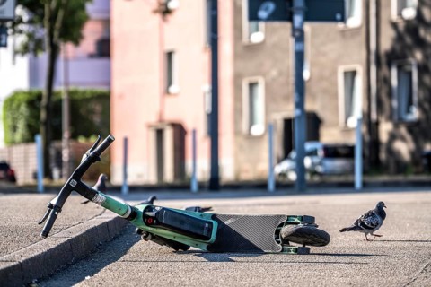 Rental scooter, e-scooter, left at the sidewalk, in Essen, North Rhine-Westphalia, Germany