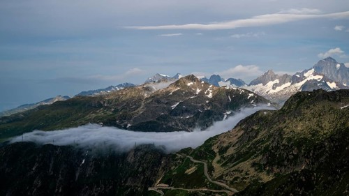 Mountain landscape with clouds of fog, Valais, Switzerland
