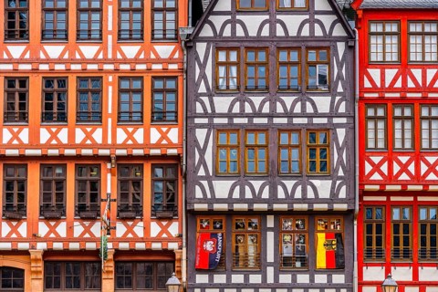 Guild signs and half-timbered houses on the Römerberg in Frankfurt am Main, Hesse, Germany