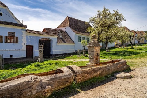 Wooden fountains and traditional Transylvanian-Saxon farms in Viscri or Deutsch-Weisskirch,
