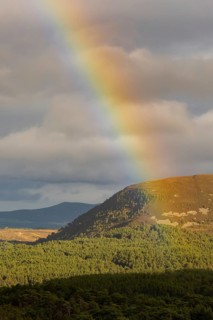 View through a rainbow from Cairngorm Mountain in the Hihglands in Scotland, Aviemore, Scotland,