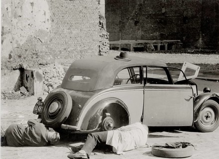 Hamburg, car repair, war damage, post-war period, two men repair an old car on a deserted street,
