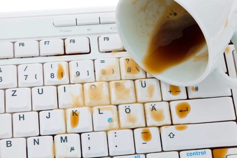 Coffee mug poured out on a computer keyboard. Insurance damage, Austria