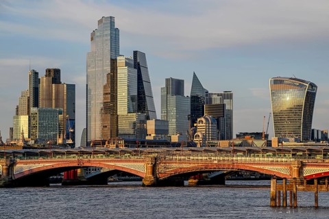 Blackfriars Bridge in front of the City of London skyline with skyscrapers 22 Bishopsgate,