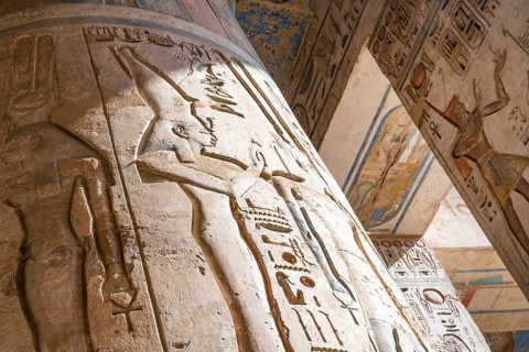 Close up details of ancient Egyptian history shown in reliefs and hieroglyphs inside Medinat Habu,