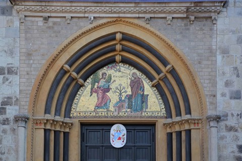 Golden wall mosaic with angel and portrait of Mary and coat of arms, inscription, Ave Maria,