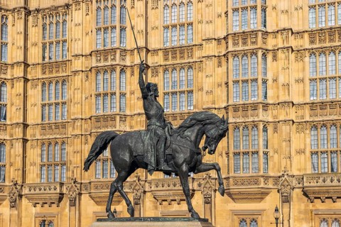 Richard the Lionheart's bronze equestrian statue by Carlo Marochetti stands before the Gothic