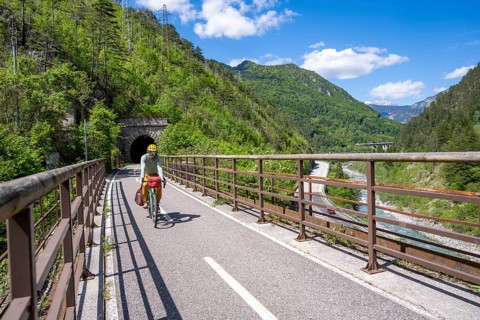 Cyclists with panniers on a cycle path, cycle path along the old Pontebba railway line in the Canal