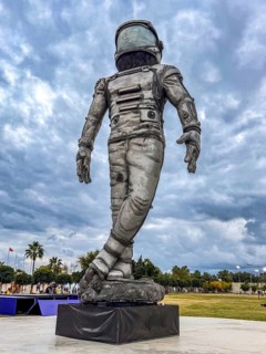 Antalya, Turkiye - 25.10.2025: A large astronaut statue stands in a park under a cloudy sky. The