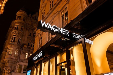 Vienna, Austria - 15 December, 2025: Wagner store front in Vienna, Austria. The illuminated sign