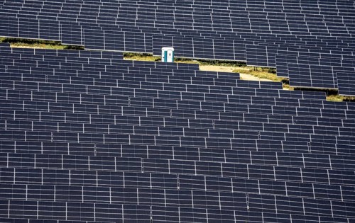 Solar park near Bad Wünnenberg-Haaren, single mobile toilet between the solar modules, North