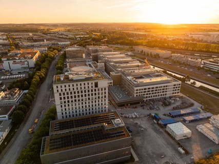 Urban architecture in an industrial area at sunset, seen from above, construction site of the new