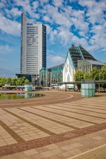 Morning atmosphere, Leipzig Augustusplatz with city skyscraper and university, reflection, water