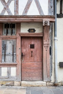 Old wooden door on a half-timbered house in the old town of Troyes, Aube department, Grand Est