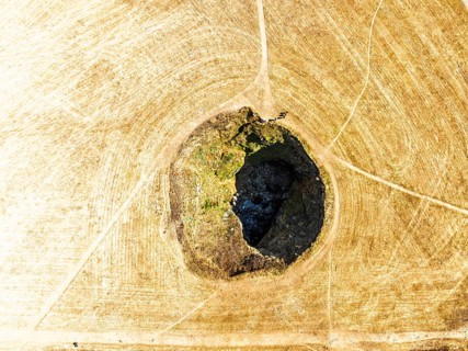 Top Down View of Trevone Round Hole over Trevone Bay from a drone, Trevone, Padstow, Cornwall,