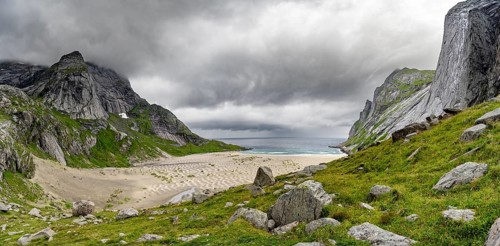 Bunesstranden sandy beach between rocky mountain peaks, Lofoten, Norway