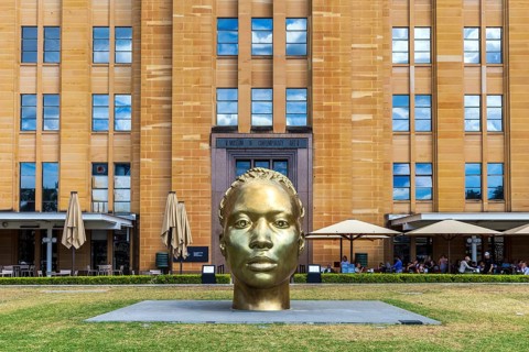 A bronze sculpture head named Ancient Feelings by Thomas J Price outside the Museum of Contemporary