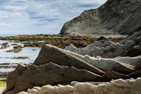 Geological formation of sandstone and limestone layers, Flysch on Itzurun Beach in Zumaia, Spain