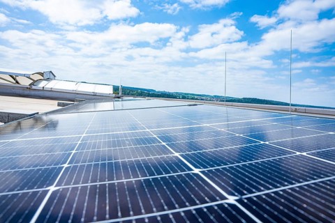 Solar panels stretch under a blue, cloudy sky, PV Assembly, Perrot, Calw, Germany