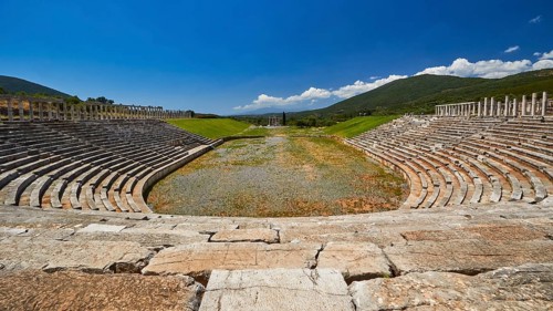 Ancient stadium with rows of stone seats in a hilly area, Messene Stadium, Ancient Site,