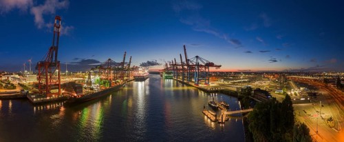 Panoramic aerial view at Waltershof harbour during the Blue Hour with Eurogate Container Terminal