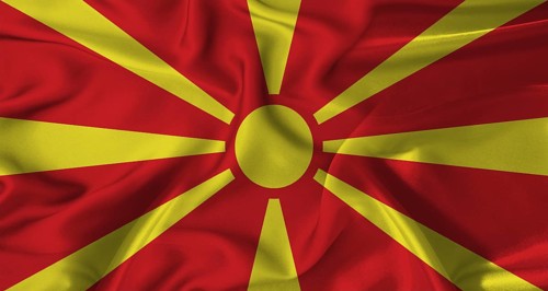 Colorful flag of North Macedonia with a silky fabric texture waving. Realistic North Macedonia flag