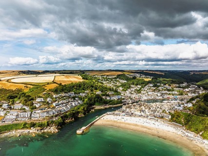 Beach and Cliffs over Looe Bay from a drone, Looe, River Looe, Cornwall, England, United Kingdom
