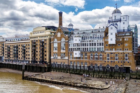 Wooden piles and worn stone steps of Horselydown Old Stairs lead down to the Thames foreshore