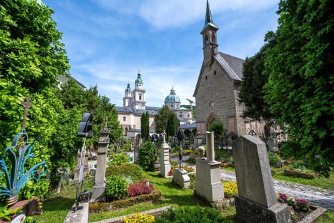 Graves at St. Peter's Cemetery with Margaret's Chapel and Cathedral, Old Town, Salzburg, Austria