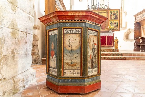 Painted wooden pulpit in the interior of the Tartlau fortified church, part of the UNESCO World