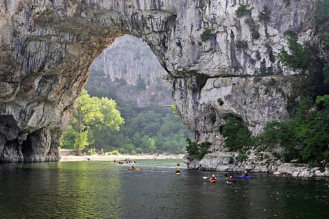Canoes on the Ardèche river, above the Pont d'Arc rock gate, Ardèche Gorge, Gorges de l'Ardèche,