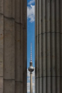 The Berlin TV Tower with historic pillars in the foreground, Berlin