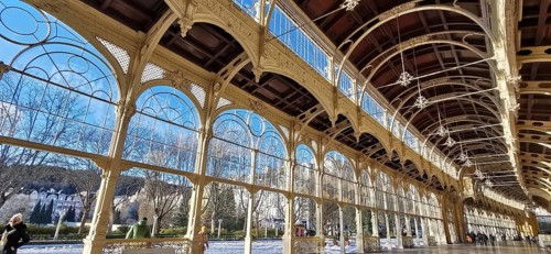 Large stained glass windows in elegant arcades with a view of a sunny day and blue sky, Maxim Gorky
